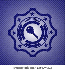 key icon inside emblem with jean texture