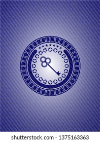 key icon inside emblem with jean high quality background