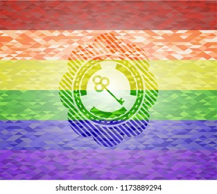 key icon inside emblem on mosaic background with the colors of the LGBT flag