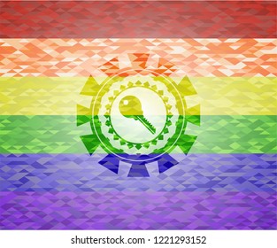 key icon inside emblem on mosaic background with the colors of the LGBT flag