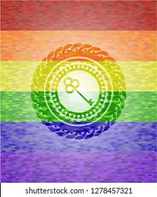 key icon inside emblem on mosaic background with the colors of the LGBT flag