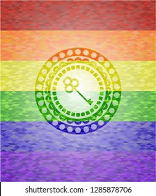 key icon inside emblem on mosaic background with the colors of the LGBT flag