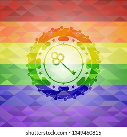 key icon inside emblem on mosaic background with the colors of the LGBT flag