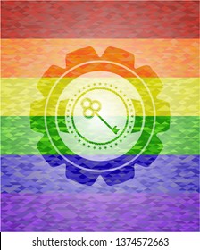 key icon inside emblem on mosaic background with the colors of the LGBT flag