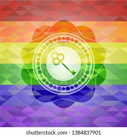 key icon inside emblem on mosaic background with the colors of the LGBT flag