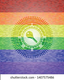 key icon inside emblem on mosaic background with the colors of the LGBT flag