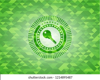 key icon inside green emblem with triangle mosaic background