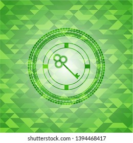 key icon inside green emblem. Mosaic background