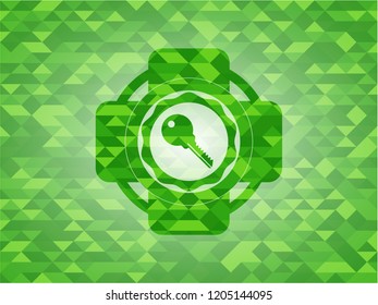 key icon inside green mosaic emblem