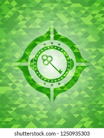 key icon inside green mosaic emblem