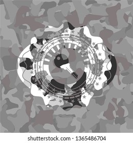 key icon inside grey camo emblem