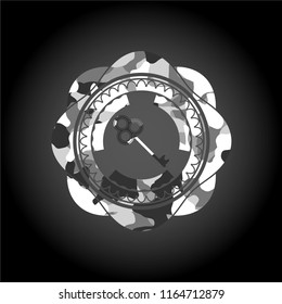 key icon inside grey camouflaged emblem