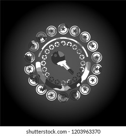 key icon inside grey camouflaged emblem