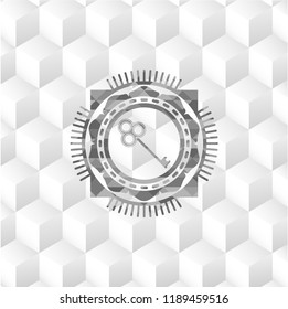 key icon inside grey icon or emblem with geometric cube white background