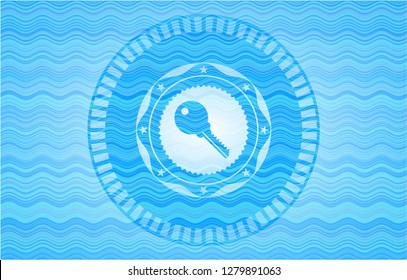 key icon inside light blue water style emblem.