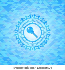 key icon inside light blue mosaic emblem