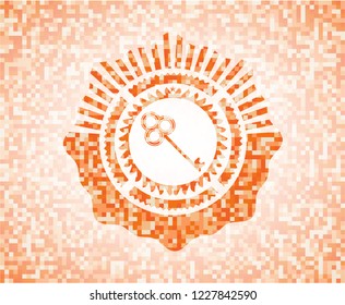 key icon inside orange mosaic emblem