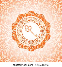 key icon inside orange mosaic emblem with background