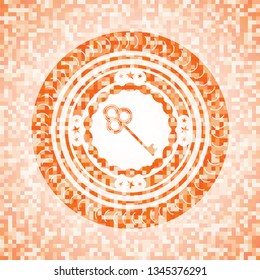 key icon inside orange mosaic emblem