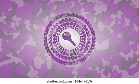 key icon inside pink and purple camouflage emblem