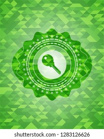 key icon inside realistic green mosaic emblem