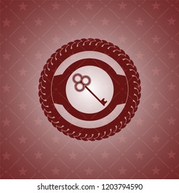 key icon inside realistic red emblem