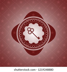 key icon inside realistic red emblem