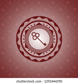 key icon inside realistic red emblem