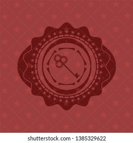 key icon inside realistic red emblem