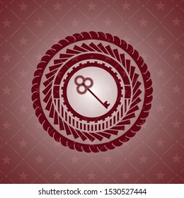 key icon inside realistic red emblem