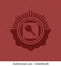 key icon inside red icon or emblem