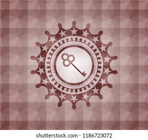 key icon inside red seamless emblem with geometric pattern background.