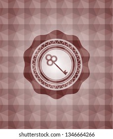 key icon inside red seamless emblem with geometric background.