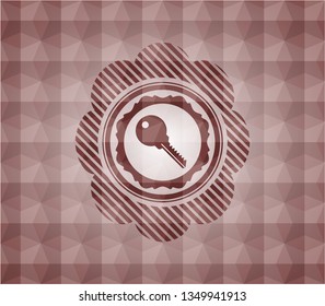 key icon inside red seamless geometric emblem.