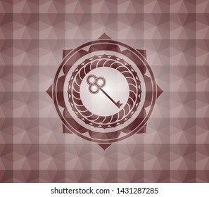 key icon inside red seamless badge with geometric pattern background.