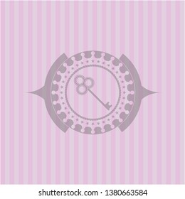 key icon inside retro pink emblem