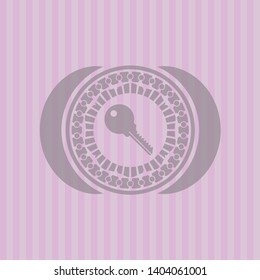 key icon inside retro pink emblem