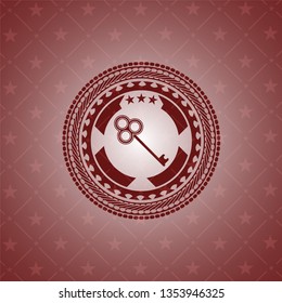 key icon inside retro red emblem