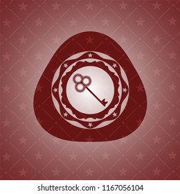 key icon inside retro style red emblem
