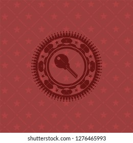 key icon inside retro style red emblem