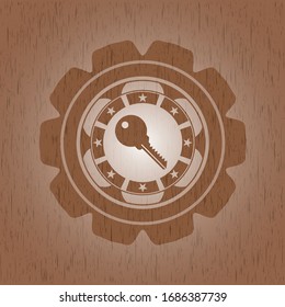 key icon inside retro wood emblem