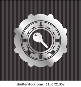 key icon inside silver badge