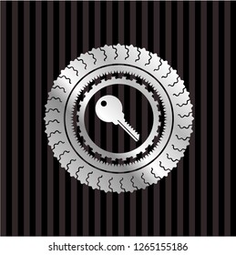 key icon inside silver badge