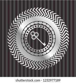key icon inside silver emblem