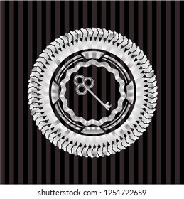 key icon inside silver emblem or badge