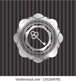 key icon inside silver emblem