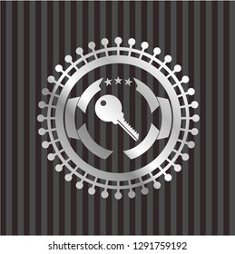 key icon inside silver shiny emblem