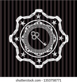 key icon inside silvery badge or emblem