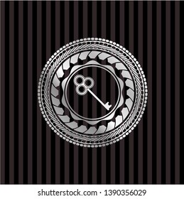 key icon inside silvery badge