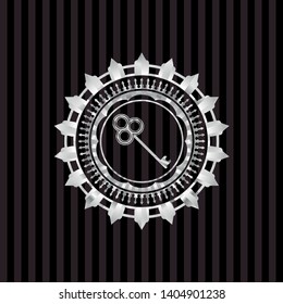 key icon inside silvery badge or emblem